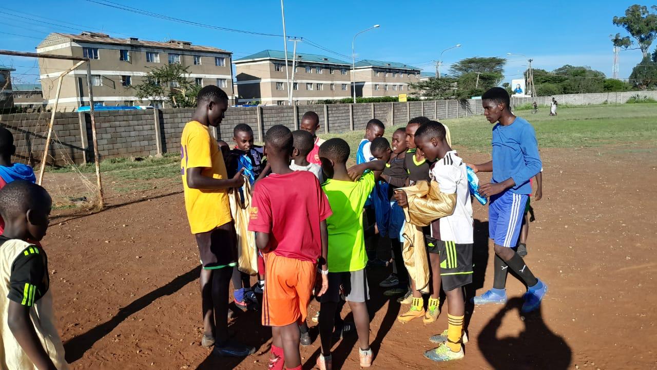 GIANTS campers playing football together